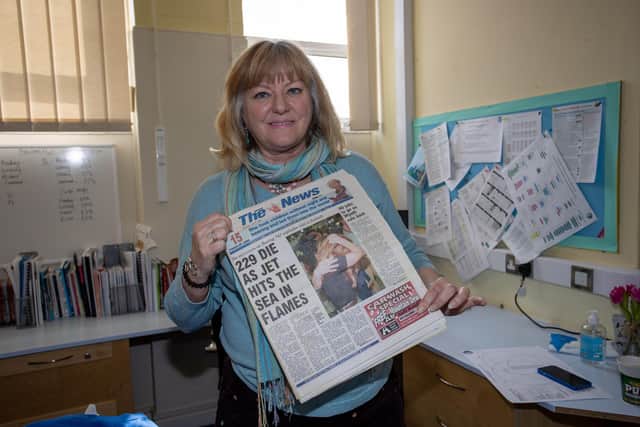 Head of School Caroline Wood of Bedenham Primary School who discovered a time capsule underneath the school stage. The copy of The News is from July 18, 1996, the day a TWA Boeing 747 crashed near Long Island, off the east coast of America Picture: Alex Shute.