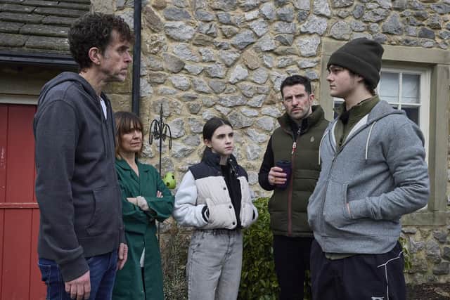 Fred Kettle on set at Emmerdale with his co-stars. Photo: ITV