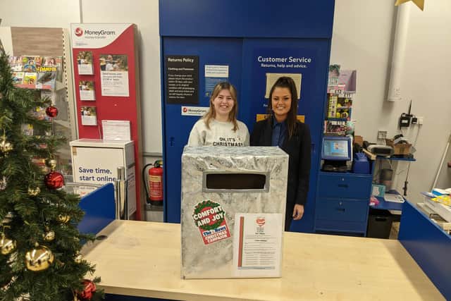 Tesco stores are supporting this year's Comfort and Joy campaign buy housing postboxes for customers to place vouchers into. Pictured: Colleagues at the Crasswell Street, Portsmouth, store
