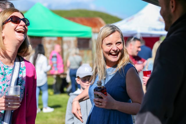 Suzy Gage and her sister, Kate Newman, left, sample some dark cherry liqueur at the Portsmouth Chilli and Gin Festival, Fort Purbrook