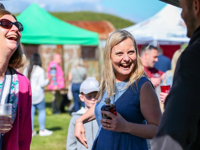 Suzy Gage and her sister, Kate Newman, left, sample some dark cherry liqueur at the Portsmouth Chilli and Gin Festival, Fort Purbrook