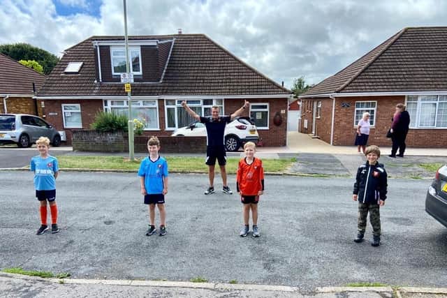 Peter Sanderson, 36, with some of the children from AFC Portchester junior teams who joined him for sections of his marathon run. (Left to right) Joshua Sanderson, 8, Ashton Cripps, 9, Dan Keech, 10, and Aleks Skila, 8.