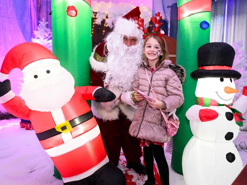 Lexie McLaverty, 7 visits Santa in his grotto at the Wickham Christmas lights switch on and fayre