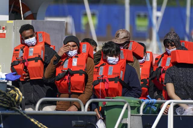 A group of people thought to be migrants are brought in to Dover, Kent, aboard a Border Force vessel following a small boat incident in the Channel. Picture date: Wednesday September 8, 2021.