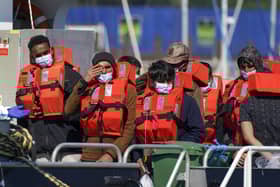 A group of people thought to be migrants are brought in to Dover, Kent, aboard a Border Force vessel following a small boat incident in the Channel. Picture date: Wednesday September 8, 2021.