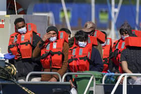 A group of people thought to be migrants are brought in to Dover, Kent, aboard a Border Force vessel following a small boat incident in the Channel. Picture date: Wednesday September 8, 2021.