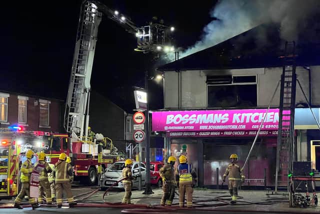 Emergency services at the scene of the fire above Bossman's Kitchen in Copnor Road on Sunday. Picture: Zack Ali