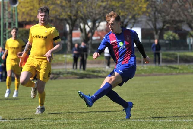 James Franklyn puts Christchurch ahead in their FA Vase fourth round tie against Christchurch. Pic: Martyn White.