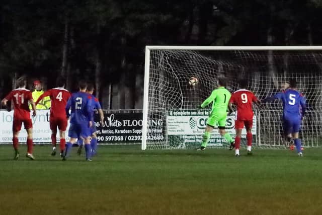 Tommy  Scutt (out of picture) puts Horndean 2-1 up against Fareham last night. Picture by Ken Walker