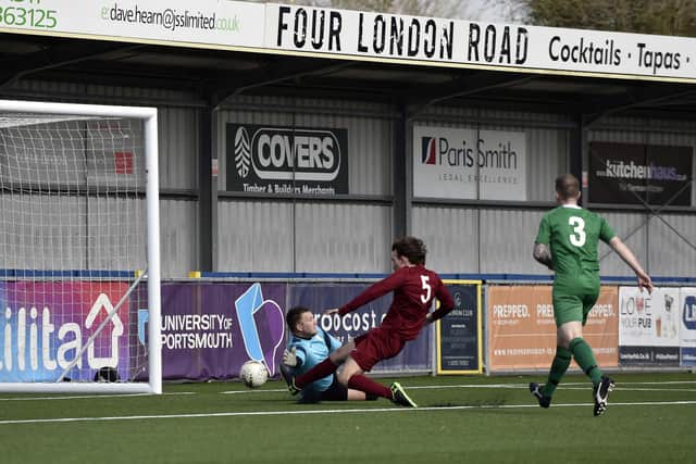 Burrfields' Sam Waterman (maroon) and Mob goalkeeper James Griffiths can't get a touch on a Jack Palmer cross during the Mid-Solent League encounter at Westleigh Park. Picture: Allan Hutchings