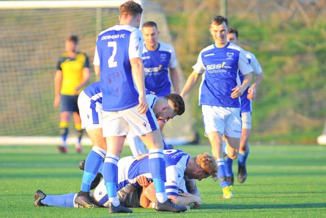Denmead celebrate one of their early goals against Moneyfields. Picture: Martyn White
