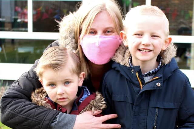 Cheryl Austin-Whittley with sons Archie and Alfie outside Mengham Infant School. Picture: Emily Turner