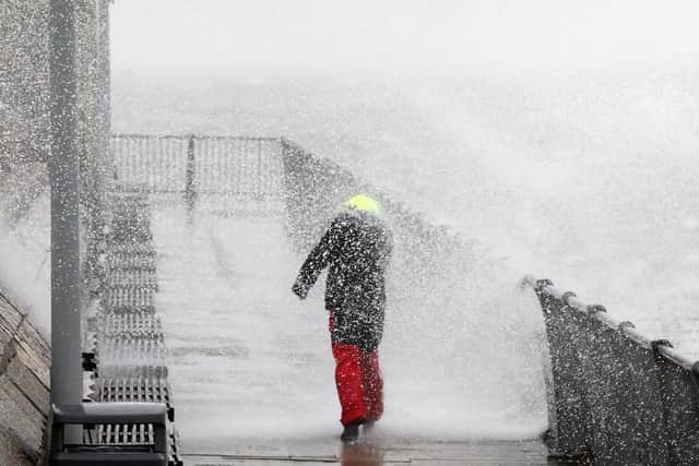 Weather watcher at Sally Port, Old Portsmouth, during Storm Ciara in 2020.
Picture: Chris Moorhouse     (090220-55)