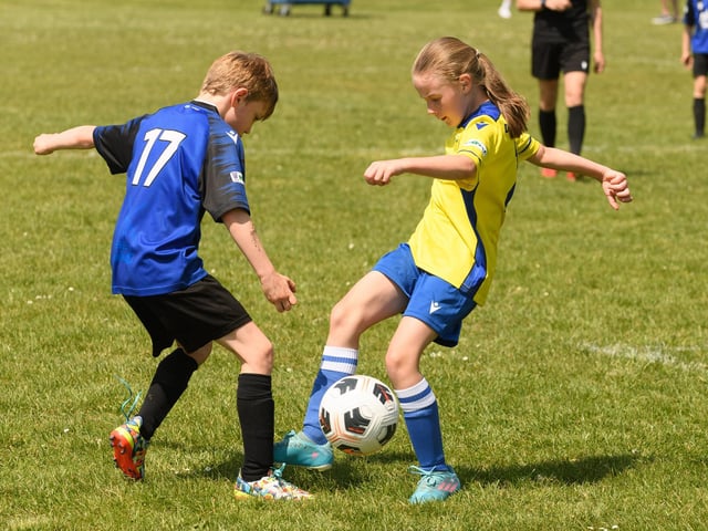 Action from the Clanfield youth football tournament at Horndean Technology College. Picture: Keith Woodland (270521-722)