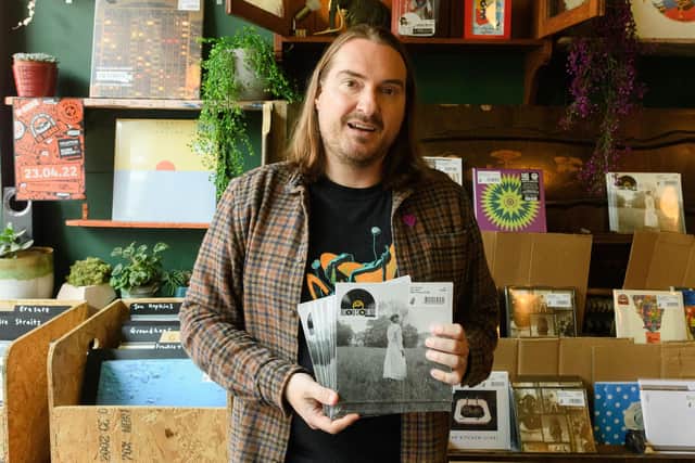 Pictured is: Steve Courtnell holding some copies of the Taylor Swift single, The Lakes. Picture: Keith Woodland (230421-10)