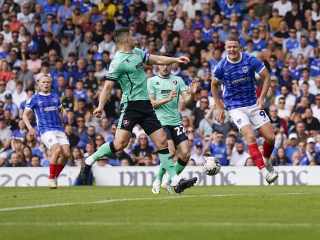 Colby Bishop attempts to close down a Cheltenham clearance in the first half.