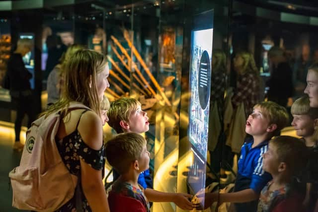 Families pictured inside the Mary Rose Museum before the coronavirus pandemic struck.