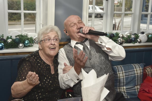 The annual Christmas lunch for OAPs at the White Hart pub in Denmead on Tuesday, December 5, 2023.
Pictured is: Pam Baker (79) from Denmead, sings with Malc De Reding.
Picture: Sarah Standing (051223-3157)