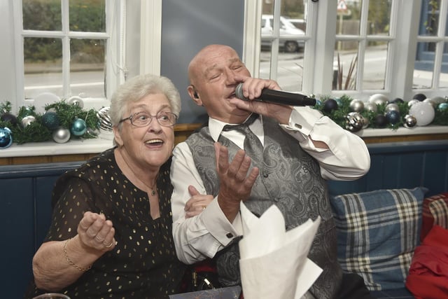 The annual Christmas lunch for OAPs at the White Hart pub in Denmead on Tuesday, December 5, 2023.

Pictured is: Pam Baker (79) from Denmead, sings with Malc De Reding.

Picture: Sarah Standing (051223-3157)