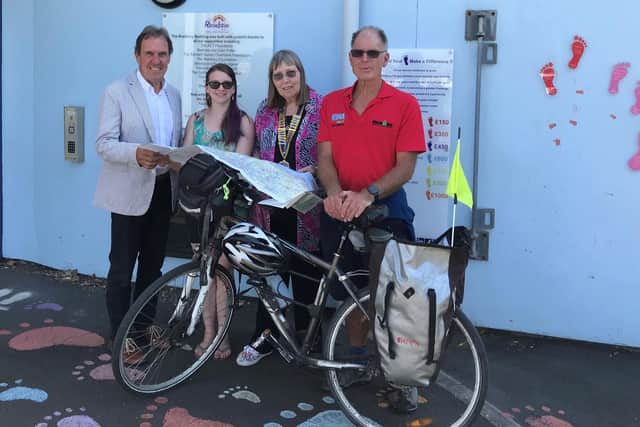 Bob Musselwhite and Richard Coghlan with Emma Dean from Rainbow fundraising and president Pam Marsden.