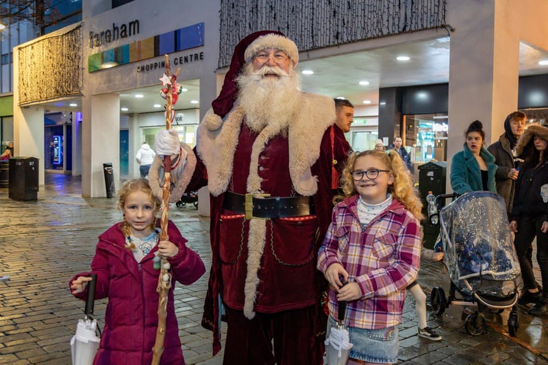 Madison Bailey (5) and Felicity Waite (7) get to see Santa in West Street, Fareham. Picture: Mike Cooter (181123)