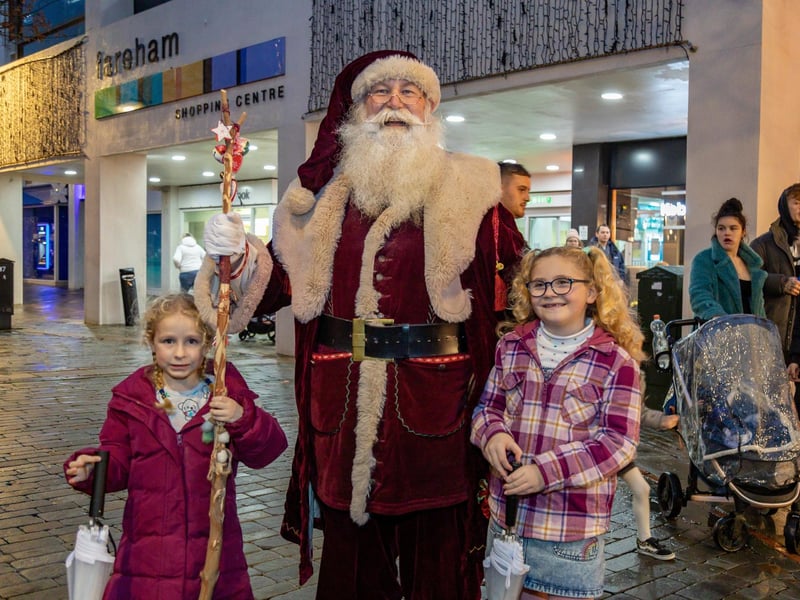 Madison Bailey (5) and Felicity Waite (7) get to see Santa in West Street, Fareham. Picture: Mike Cooter (181123)