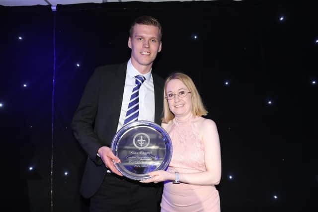Sean Raggett receives an award from Gemma Raggett (no relation) from Portsmouth Football Supporters Club London - one of eight awards he collected on the evening. Picture: Robin Jones