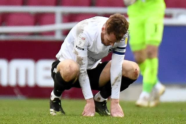 Pompey captain Tom Naylor at the full-time whistle at Northampton. Picture: Dennis Goodwin