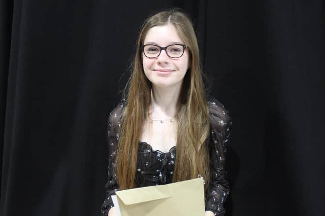 Millie celebrates her results