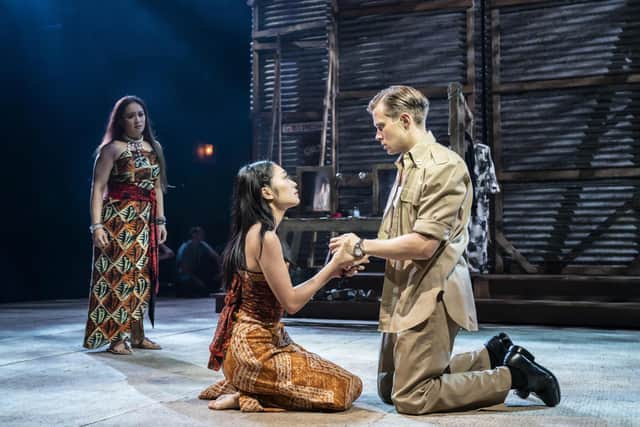 South Pacific at Chichester Festival Theatre, summer 2021. Joanna Ampil (Bloody Mary), Sera Maehara (Liat) & Rob Houchen (Joe Cable). Picture by Johan Persson