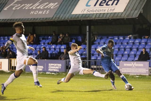 Josh Passley (left) and Joe Newton attempt to block a cross at Tonbridge last night. Picture: Lily Moore.