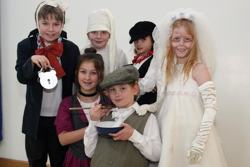 Abercrombie pupils Micheal Mcgregor, Ethan Agutter, Courtney Carter, Lucy Hayes.with (front row) Charlie Brown and Cate Davey celebrating the bicentinary. of Charles Dickens