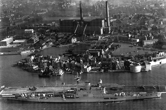 HMS Victorious leaves Portsmouth Harbour some time after 1950.