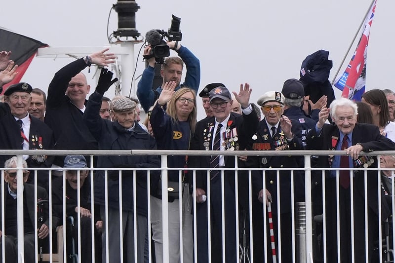 Normandy veterans wave from on board the Brittany Ferries ship Mont St Michel. Photo: Andrew Matthews/PA Wire