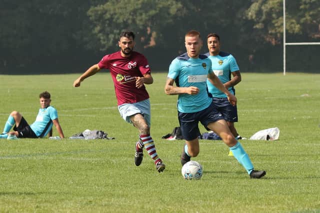 Warren Wanderers (blue) v Cross Keys. Picture by Kevin Shipp.
