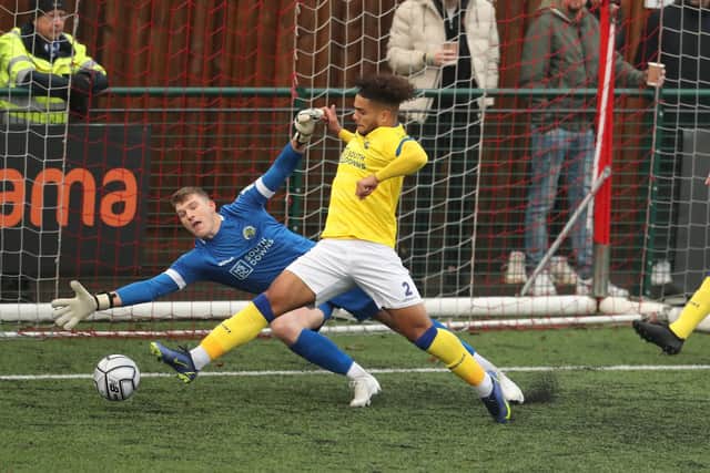 Will Mannion and Josh Passley can't stop Niall MacManus from making it 3-0. Picture: Dave Haines