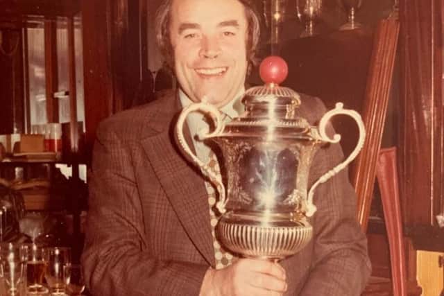 Derek Clark with one of his trophies