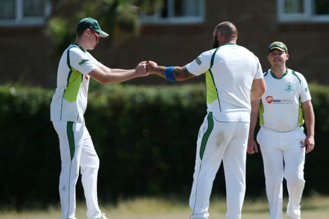 Emsworth's socially distant wicket celebration against Hayling Island. Picture: Chris Moorhouse