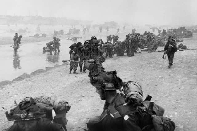British troops take positions on Sword beach during D-Day June 6 1944 after Allied forces stormed the Normandy beaches. (Photo credit should read STR/AFP/Getty Images)