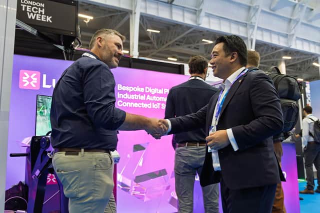 Alan Mak MP talks to an exhibitor at London Tech Week