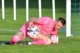 Harvest keeper Jordan Camburn makes a save in the penalty shoot-out. Picture by Martyn White