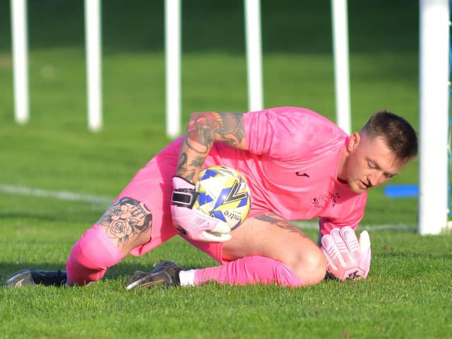 Harvest keeper Jordan Camburn makes a save in the penalty shoot-out. Picture by Martyn White