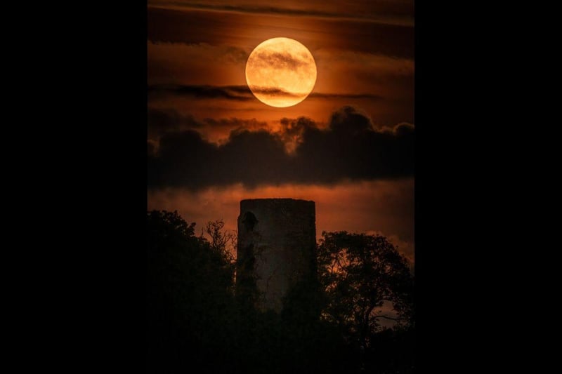 Harvest moon over Racton Ruins by Nathan Hill