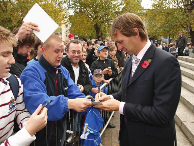 Tony Adams signs autographs for fans outside Portsmouth Guildhall in 2008