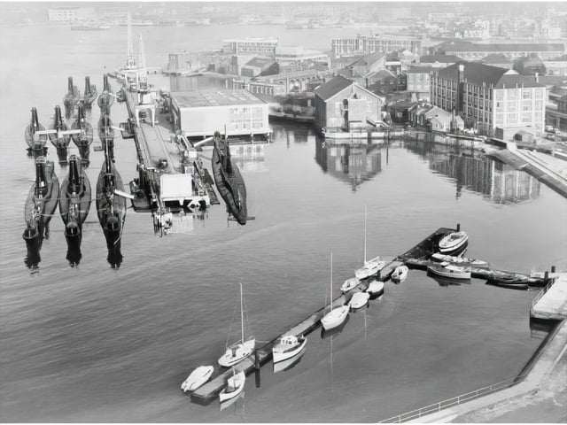 Submarine docks at HMS Dolphin in Gosport. HMS Dolphin was the home of the Submarine Service from 1904 to 1999, and the site of the Royal Navy Submarine School. It is among the treasure troves of photos archivists in Gosport have highlighting the lives of submariners. Credit: Imperial War Museum