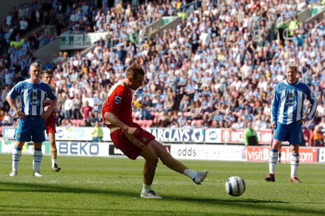 Matt Taylor's second-half penalty at Wigan retained Pompey's Premier League status in April 2006. Picture: Jonathan Brady