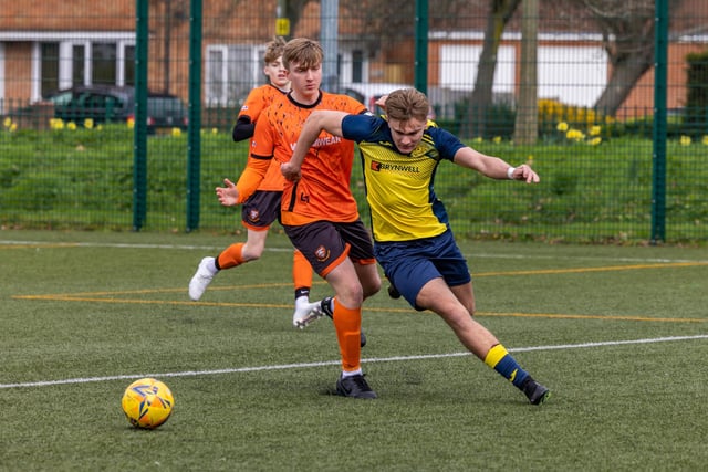 Action from the 2-2 draw between the under-18s of Moneyfields (blue/yellow kit) and AFC Portchester (orange/black kit). Picture: Mike Cooter