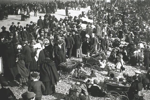 Crowds and prams on the beach at Southsea, England, 1890s. (Photo by F. J. Mortimer/Hulton Archive/Getty Images)