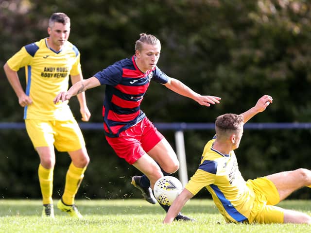 Zak Willett (red/blue) has scored 80 goals in just 36 appearances for Paulsgrove and Southsea United this season. 
Picture: Chris Moorhouse