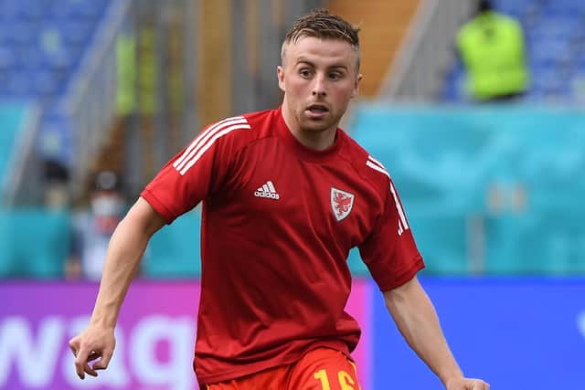 Joe Morrell warms up for Wales. Picture: Alberto Lingria - Pool/Getty Images